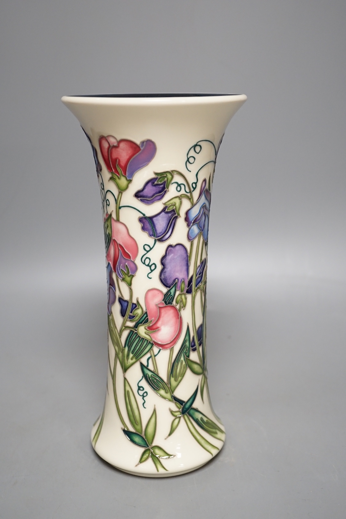 A Moorcroft 'sweetness' vase, boxed, 25 cms high.